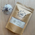 Salish Seak herbal Soaking Salts in a brown resealable pouch with a clear window showing white bath salts