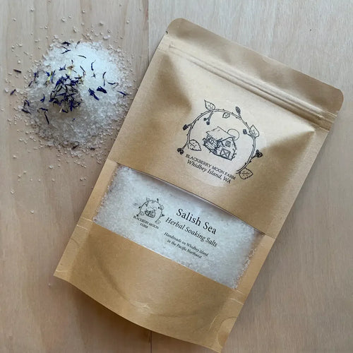 Salish Seak herbal Soaking Salts in a brown resealable pouch with a clear window showing white bath salts