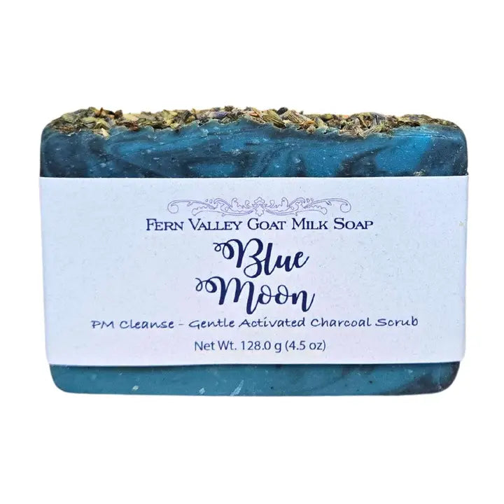Blue Moon goat milk soap bar with activated charcoal scrub on white background