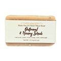 Oatmeal and honey goat milk soap bar with label on white background