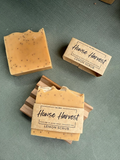 Handmade lemon scrub soap bars with label and wooden soap dish