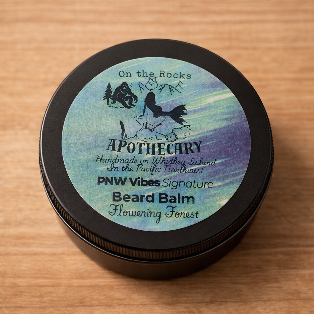 Locally made Flowering Forest beard balm by On the Rocks Apothecary in a 2oz tin from Whidbey Island on wood background