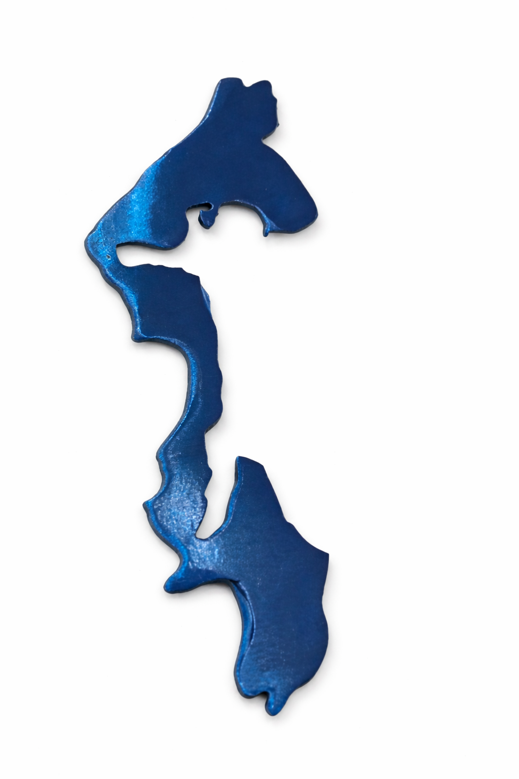 Locally made steel magnet shaped like Whidbey Island in Washington with blue metallic finish